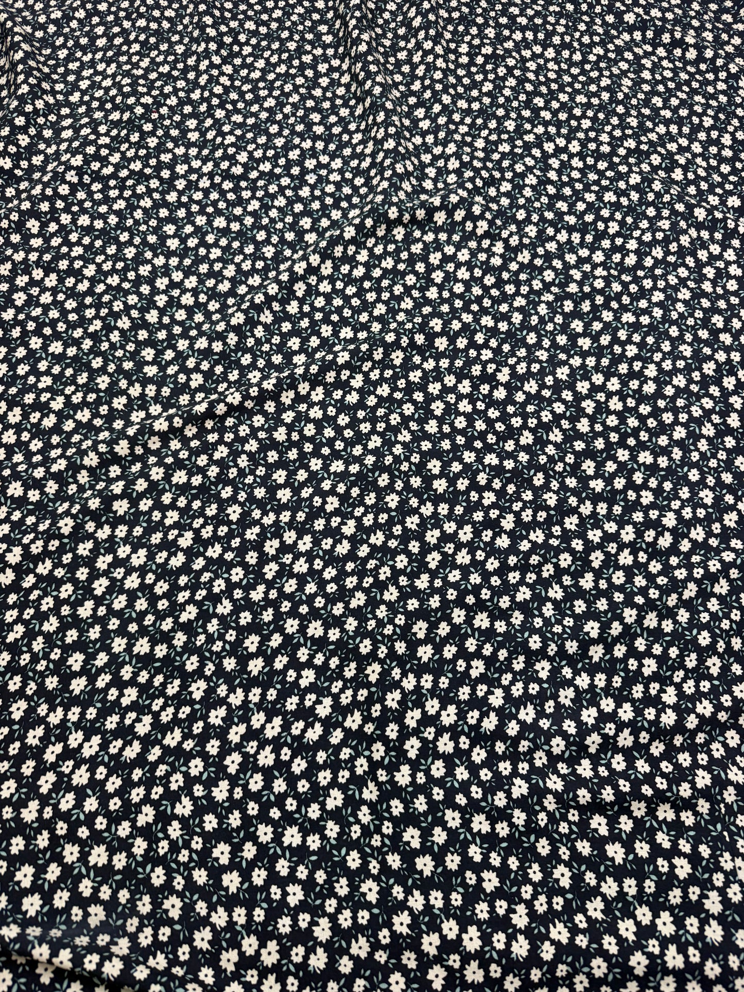 Cream Daisy on Black Viscose Dress Fabric | Sold by the Metre