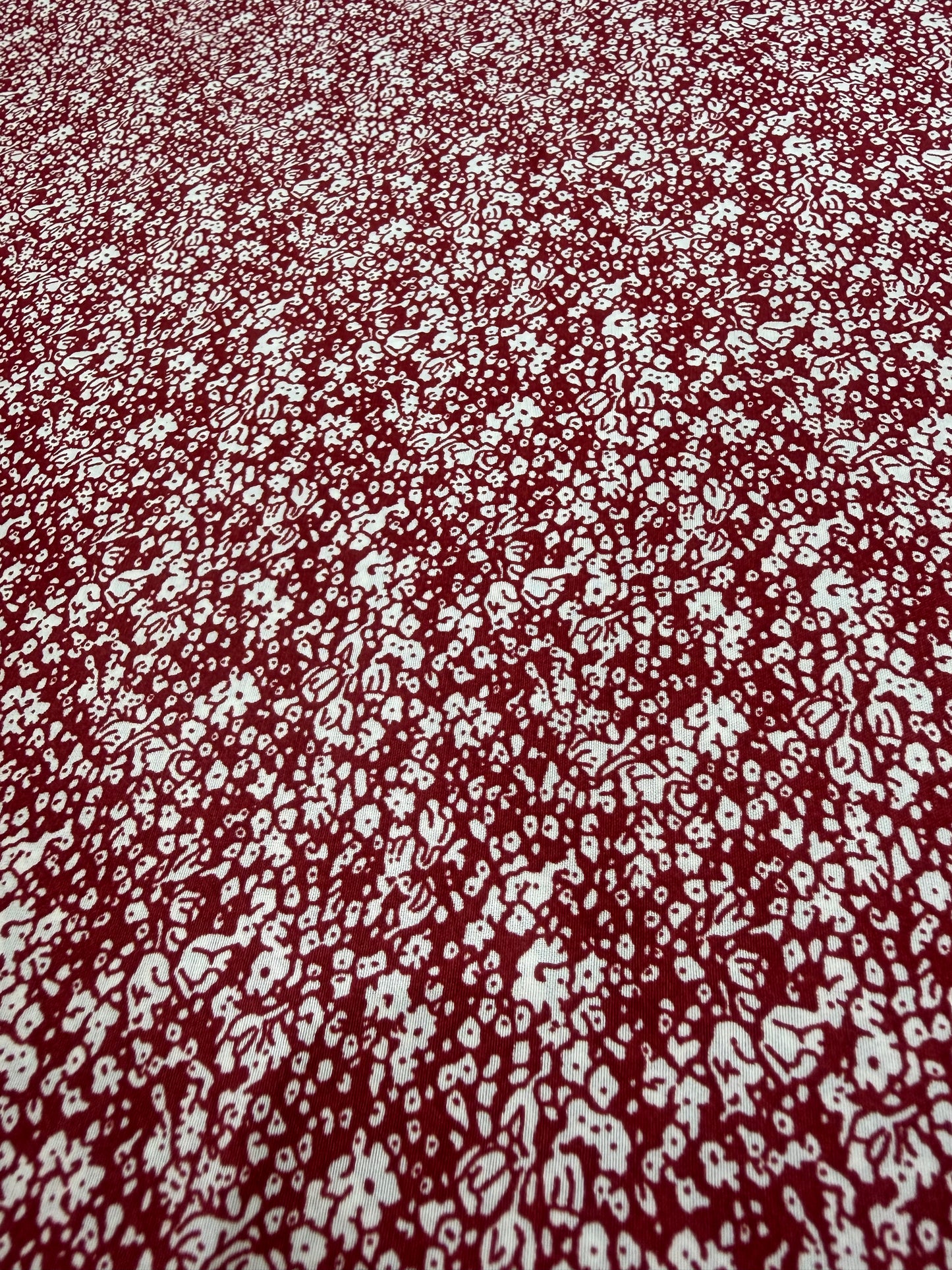 White Ditsy on Burgundy Polyester Dress Fabric | Sold by the Metre
