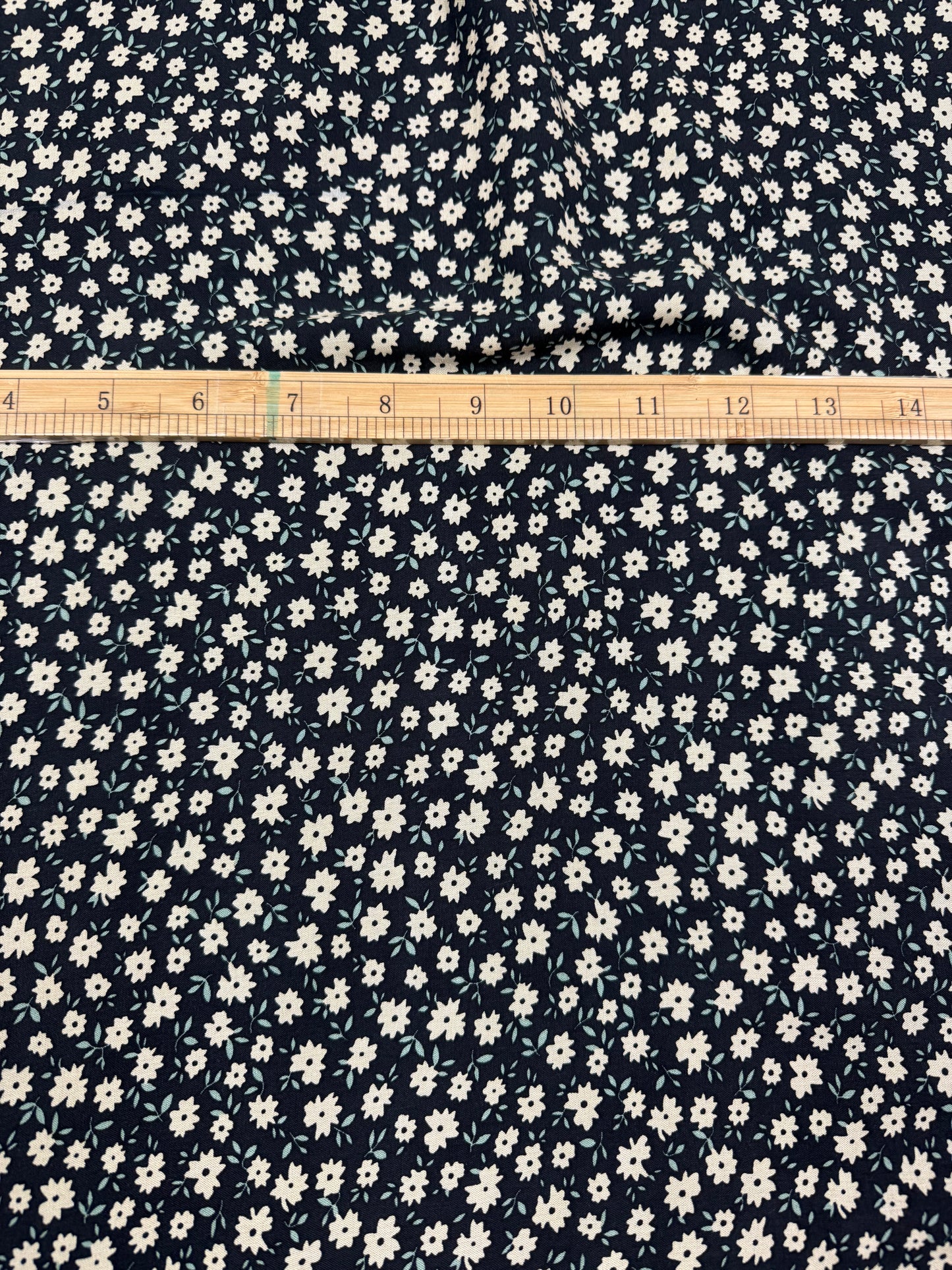 Cream Daisy on Black Viscose Dress Fabric | Sold by the Metre