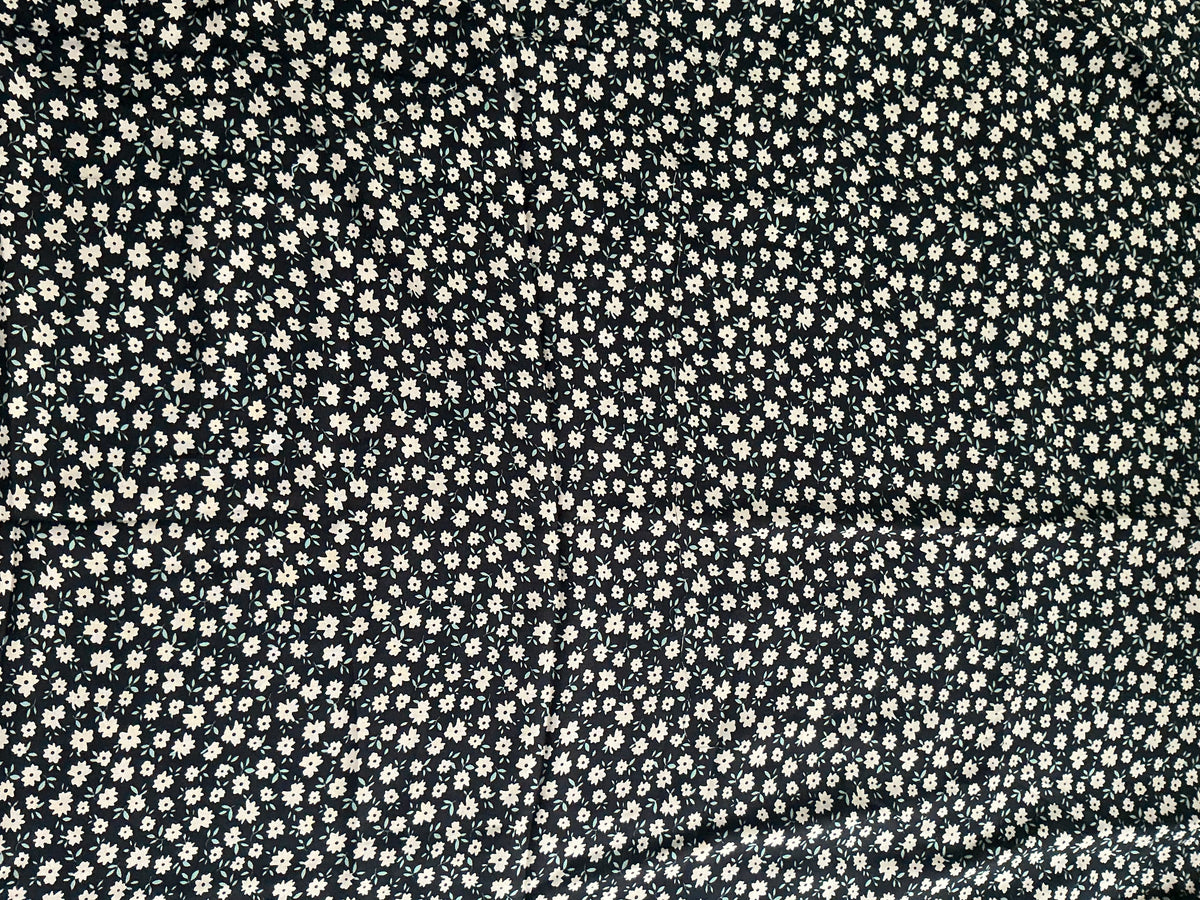 Cream Daisy on Black Viscose Dress Fabric | Sold by the Metre