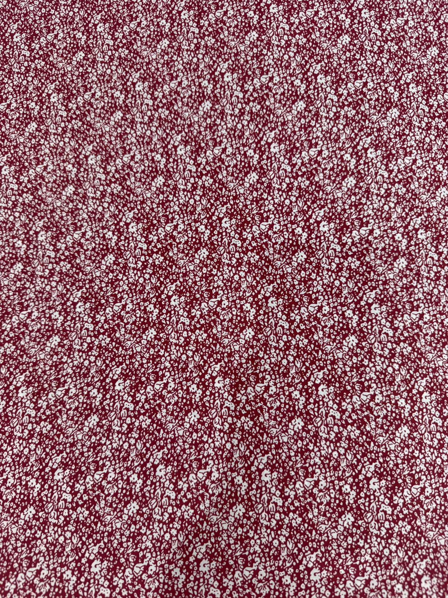 White Ditsy on Burgundy Polyester Dress Fabric | Sold by the Metre