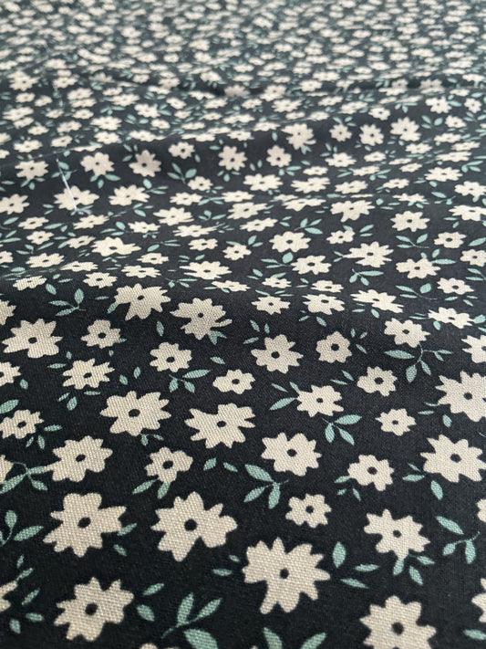 Cream Daisy on Black Viscose Dress Fabric | Sold by the Metre