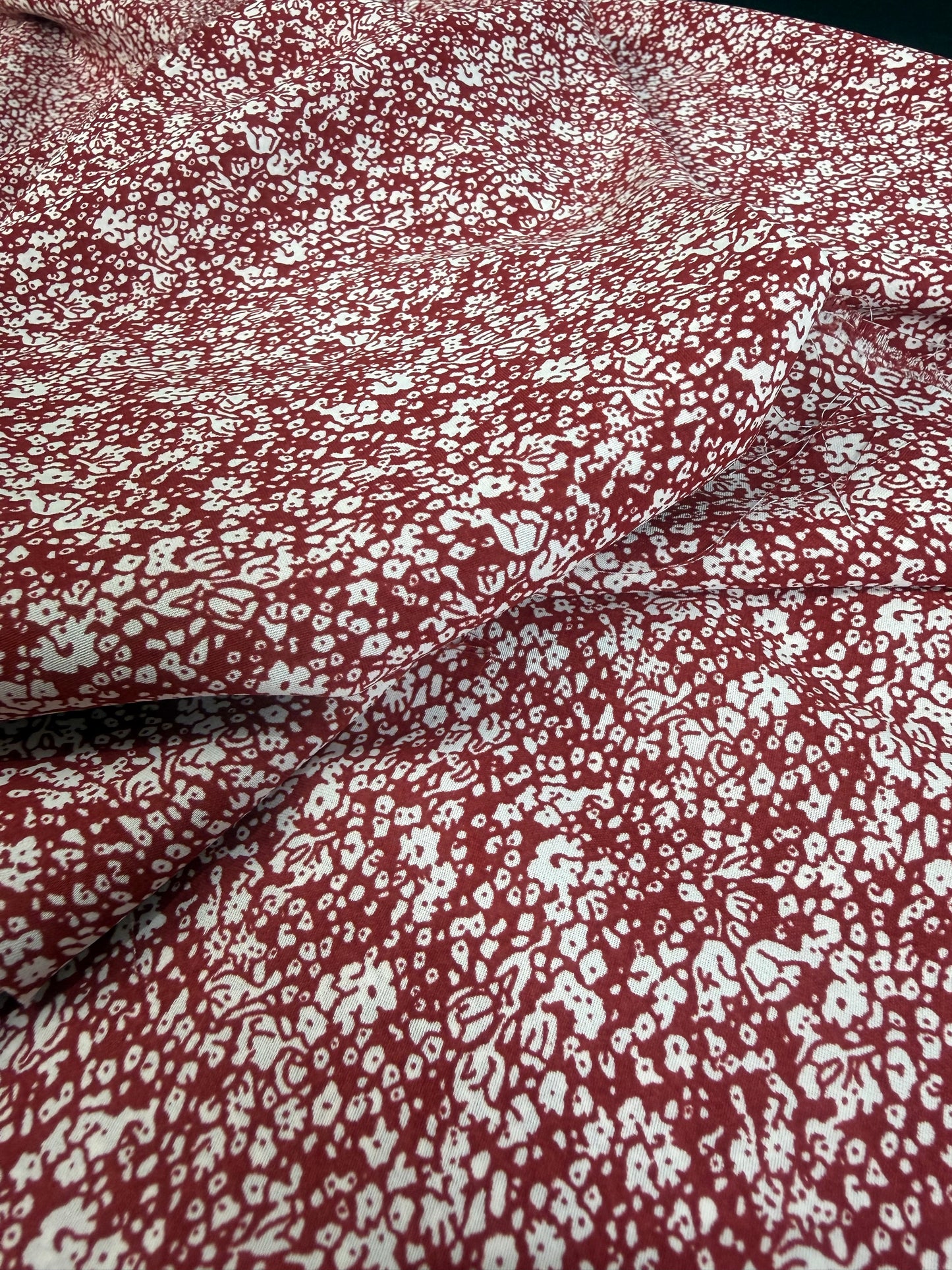 White Ditsy on Burgundy Polyester Dress Fabric | Sold by the Metre