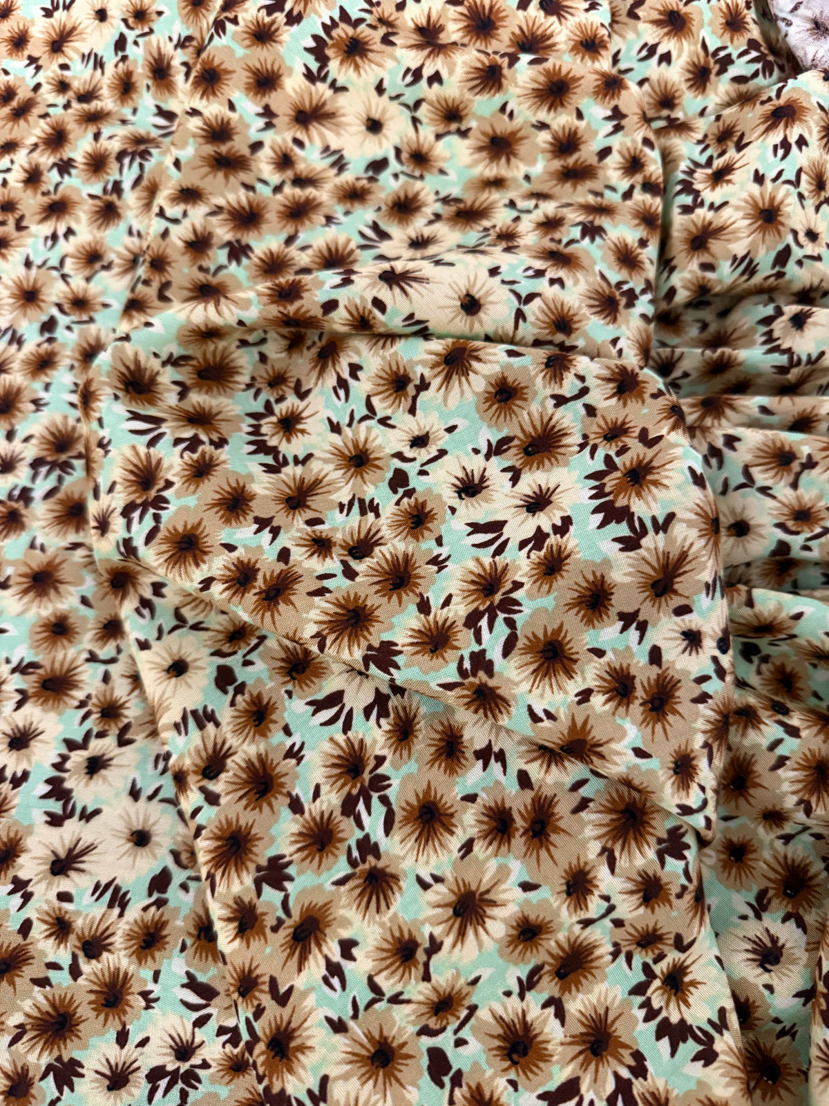 Chocolate Daisy on Mint Viscose Dress Fabric | Sold by the Metre