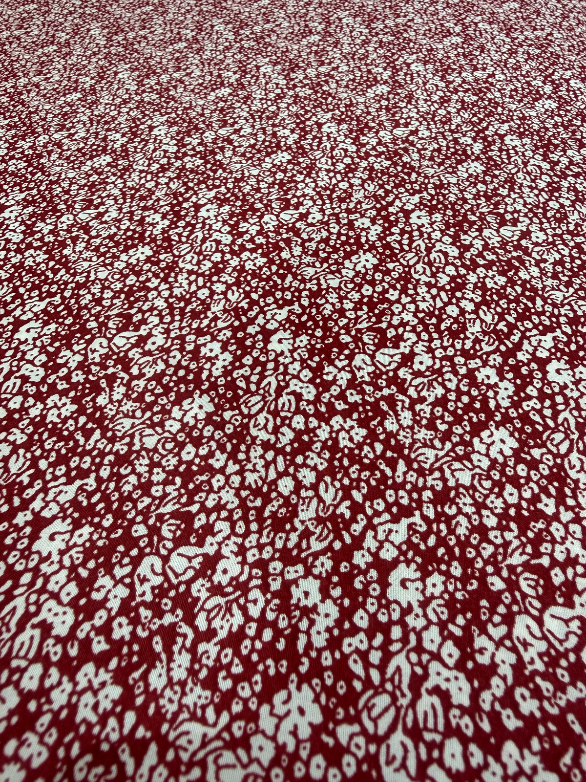 White Ditsy on Burgundy Polyester Dress Fabric | Sold by the Metre